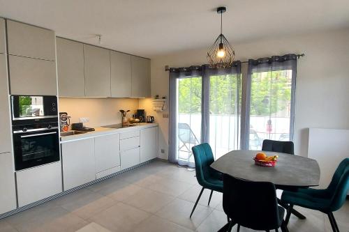 Photo de la galerie de l'établissement L ESCAPADE T2 neuf proche lac classe, à Annecy