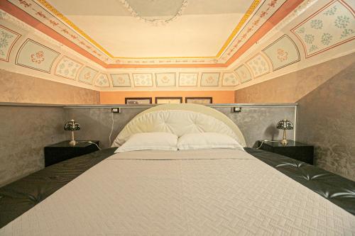 a bedroom with a large bed with a coffered ceiling at Dimora patrizia in centro in Genova