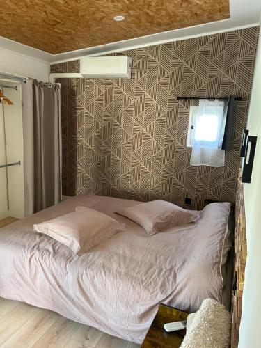 Кровать или кровати в номере Appartement plain-pied 4 couchages