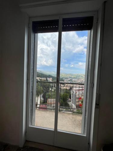 a window with a view of a city at Salemi BnB in Salemi