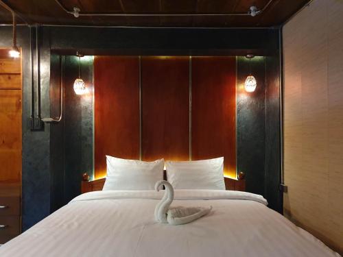 Cama o camas de una habitación en Vintage54 Hotel Ayutthaya