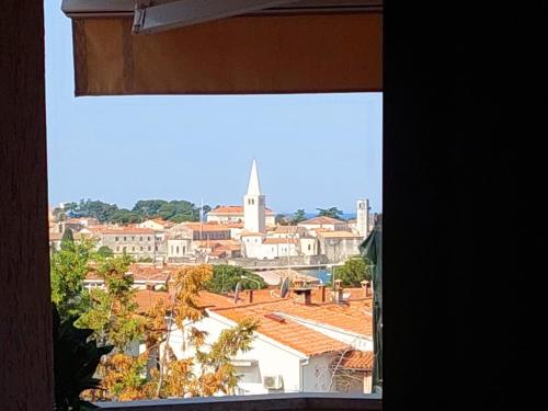 a view of a city from a window at Apartaments Victoria in Poreč