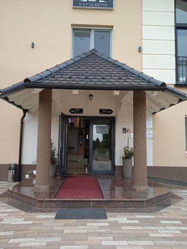 an entrance to a building with an open door at Navigator in Palić