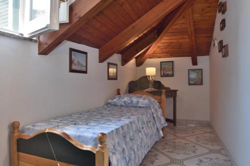 a bedroom with a bed and a desk in a room at Luna Rossa in Minori