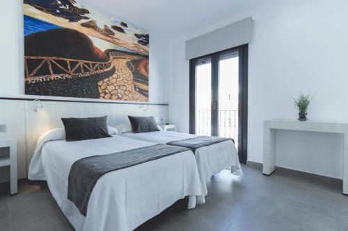Postel nebo postele na pokoji v ubytování Hostal El Yunque