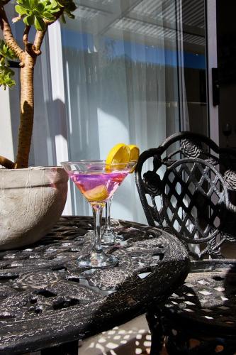 a martini glass sitting on top of a table at Gilcrest Place Guest House in Paternoster