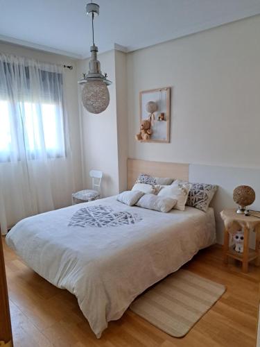 Un pat sau paturi într-o cameră la La Casa del Ciprés