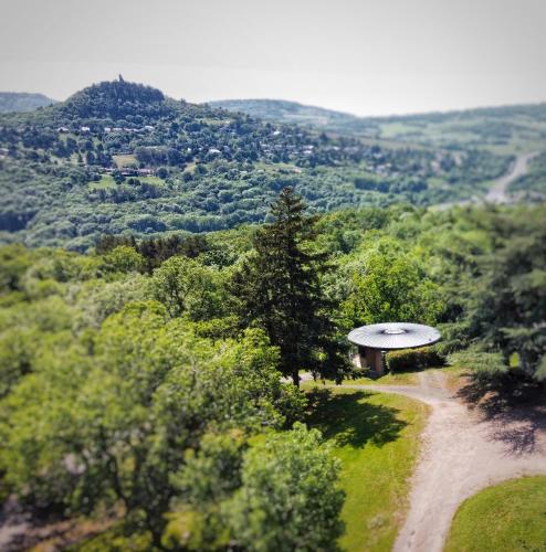 a small building on the side of a dirt road at Hotel De Plein Air Le Chanset in Ceyrat