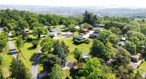 an aerial view of a home with trees and a road at Hotel De Plein Air Le Chanset in Ceyrat