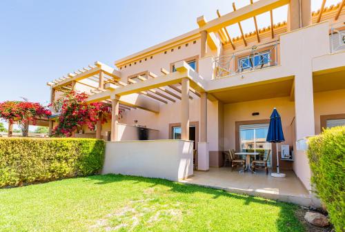 a view of a house with a yard at Casa Colina 2 in Albufeira