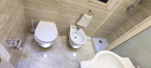 a bathroom with a toilet and a bidet at Villa Arianna B&B in Taormina