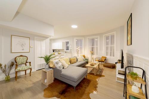 a living room with a couch and a table at The East Rock, 4BR, On-site Parking, Washer & Dryer, Walk to Yale in New Haven