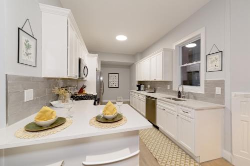 a kitchen with white cabinets and white counter tops at The East Rock, 4BR, On-site Parking, Washer & Dryer, Walk to Yale in New Haven