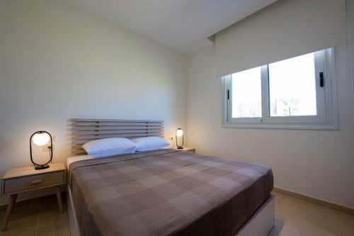Ένα ή περισσότερα κρεβάτια σε δωμάτιο στο Stayr Somabay - Bay Life Home Rentals