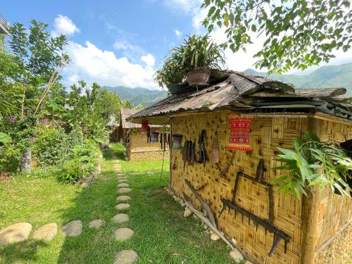 a small wooden building with plants on top of it at Sapa Bamboo Eco in Sa Pa