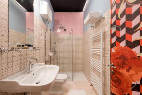 a bathroom with a sink and a toilet at Winery & Design hotel ROXANICH in Motovun