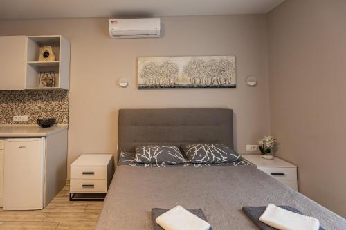 a bedroom with a bed with two pillows on it at Aura Home in Dnipro