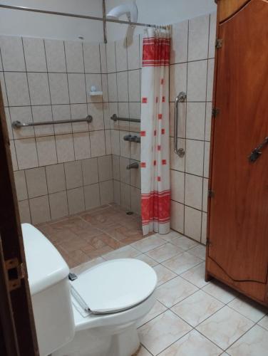 a bathroom with a toilet and a shower at Nature house in Monteverde Costa Rica