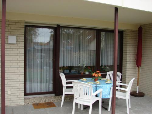 a table and chairs sitting on a patio at Christa & Wilfried Lammermann in Hooksiel