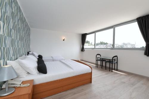 Postel nebo postele na pokoji v ubytování Hotel Tolero