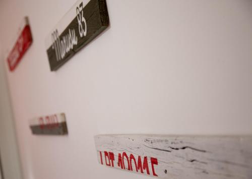 a white refrigerator with magnets on the side of it at Orlando Bayview in Balestrate