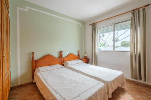 A bed or beds in a room at Marblau 4