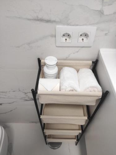 a bathroom with a towel rack next to a sink at Penthouse Las Americas first line de lux in Arona