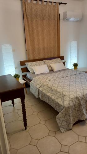 Ένα ή περισσότερα κρεβάτια σε δωμάτιο στο ISLAND HOME