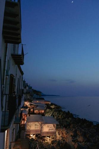 a group of buildings with a view of the ocean at Terrazza Roberto in Cefalù