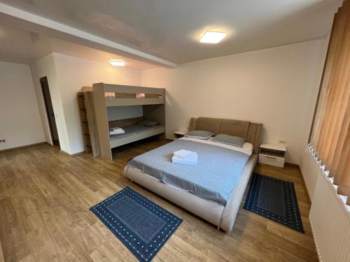 a small bedroom with a bed and a shelf at Casa Eva in 2 Mai