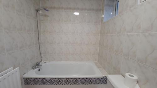 a bathroom with a shower with a toilet and a sink at Fully Furnished 3 bedroom Appartment in Bristol