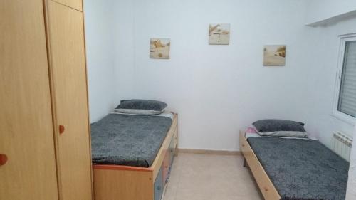 Ένα ή περισσότερα κρεβάτια σε δωμάτιο στο Apartamento en la zona Turística de Salou