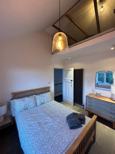 a bedroom with a bed with a fish tank on it at Stylish Unique 3 Bedroom House Hastings in Hastings