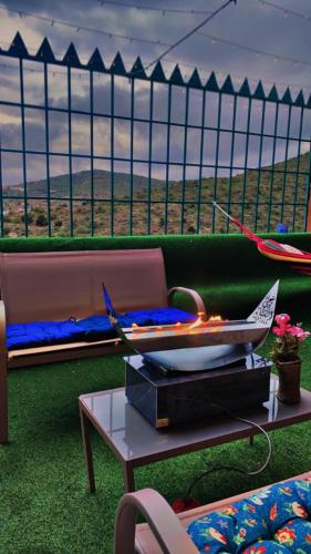 a living room with a couch and a table at هتان السودة Hattan Al Soudah in Suda