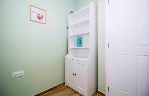 a room with a white closet and a white door at Cosy House in the Heart of Gytheio in Gythio
