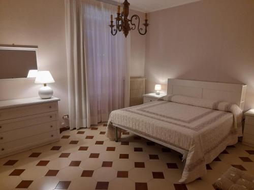 Säng eller sängar i ett rum på Appartamento al Civico 4