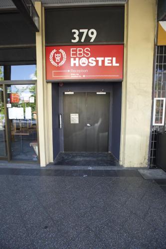 a building with a sign that reads eggs hospital at EBS Sydney Hostel in Sydney