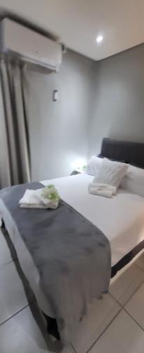 מיטה או מיטות בחדר ב-801 Guesthouse