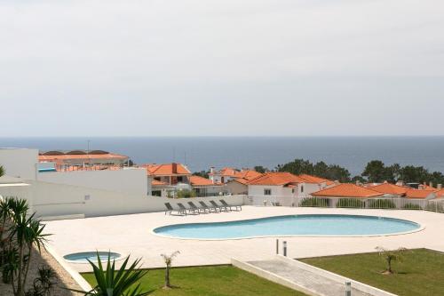 a view of the swimming pool of a villa at Nazaré Seashell House in Nazaré
