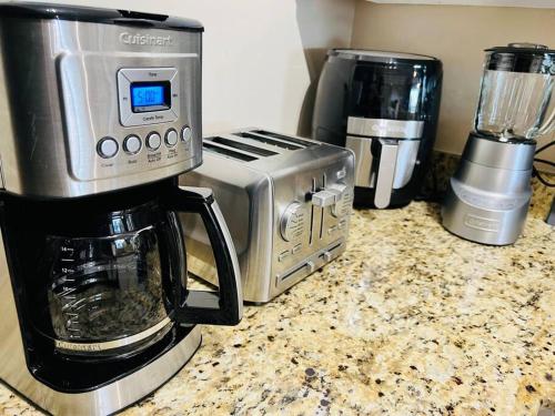 a kitchen counter with a toaster and a coffee maker at Beach House Getaway in Duck Key