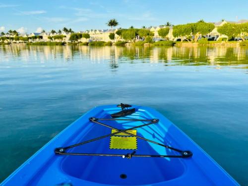 a blue kayak sitting on top of the water at Beach House Getaway in Duck Key