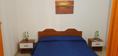 מיטה או מיטות בחדר ב-HOME COLUCCI
