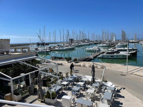 a marina with a bunch of boats in the water at Atmosfere di mare in Marina di Ragusa