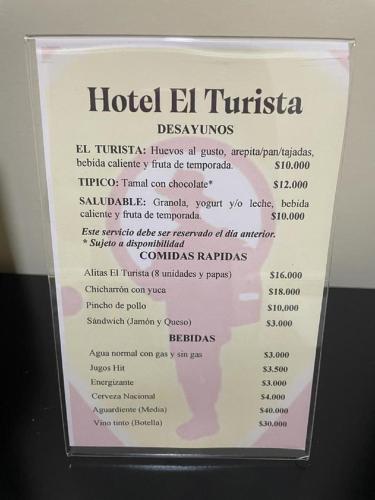 a sign for a hotel el trinidad dining menu at Hotel el Turista in Florencia