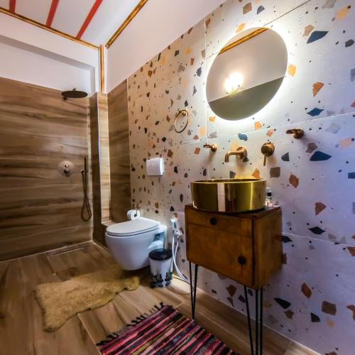 a bathroom with a sink and a mirror at Oda`s Room in Sarandë