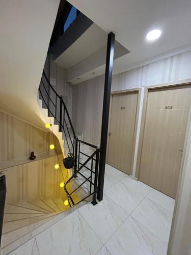 a staircase in a building with lights on the floor at Hotel Marioni in Tbilisi City
