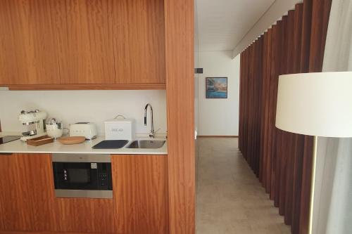 a kitchen with a sink and a counter top at Terrabona Nature & Vineyards in Boaventura