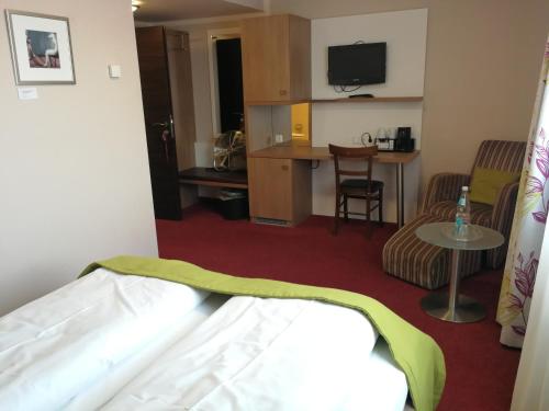 Katil atau katil-katil dalam bilik di TRIP INN PostHotel Düren