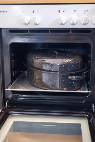 a cake is sitting inside of an oven at Isidora Summer House in Skála Foúrkas