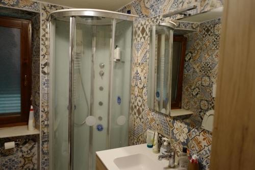 a bathroom with a shower and a sink at Villa di Piera in Montieri